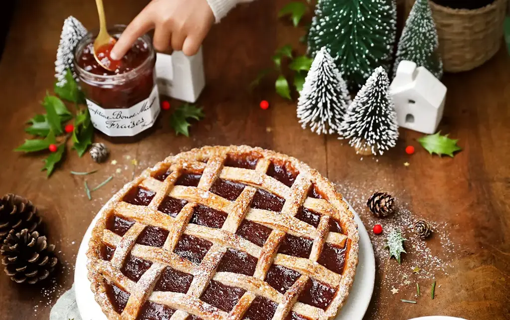 Christmas Linz tart with strawberry jam and Christmas spices